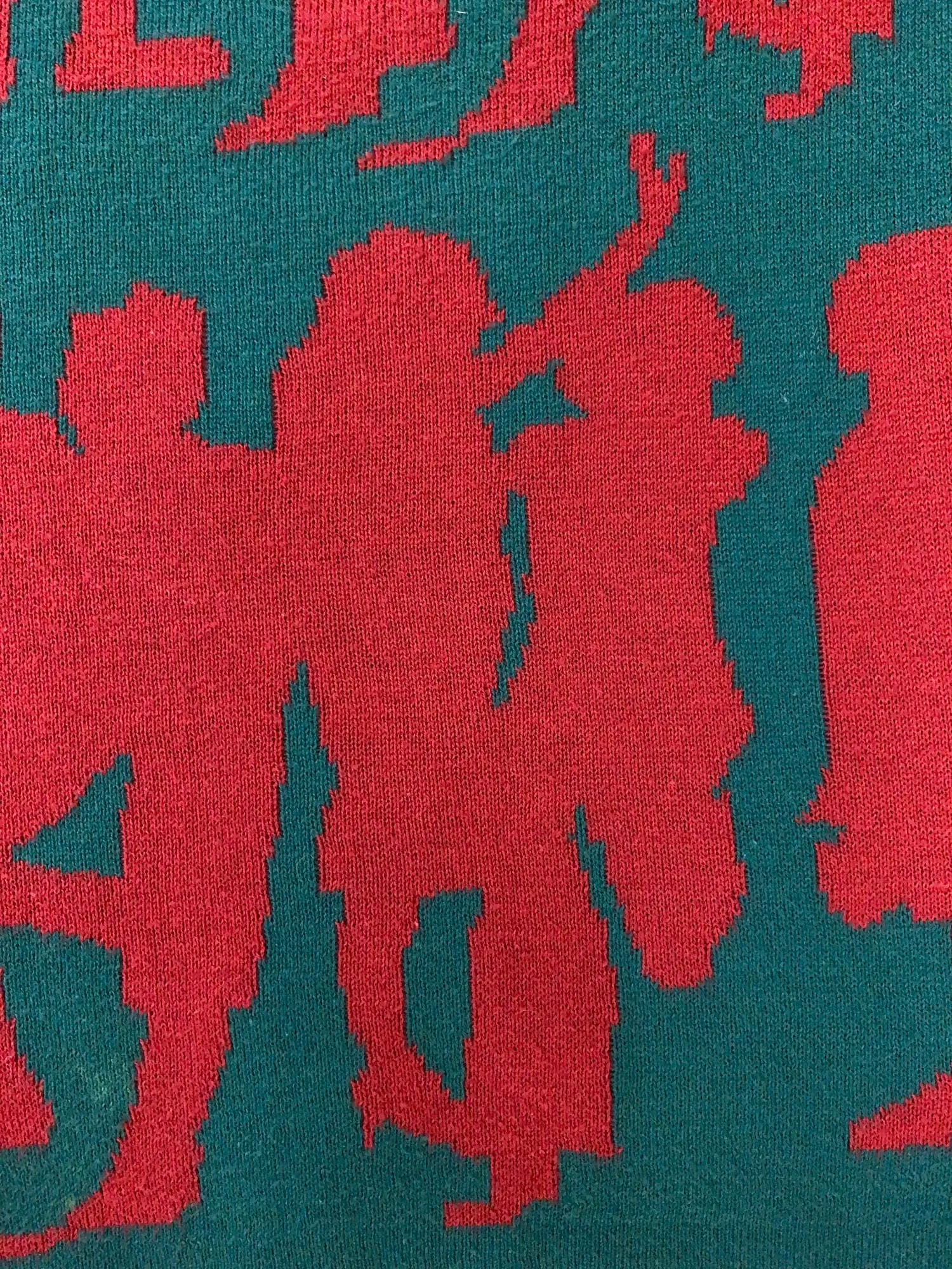 Jocomomola de Sybilla green knitted cotton vest with red dancing figures