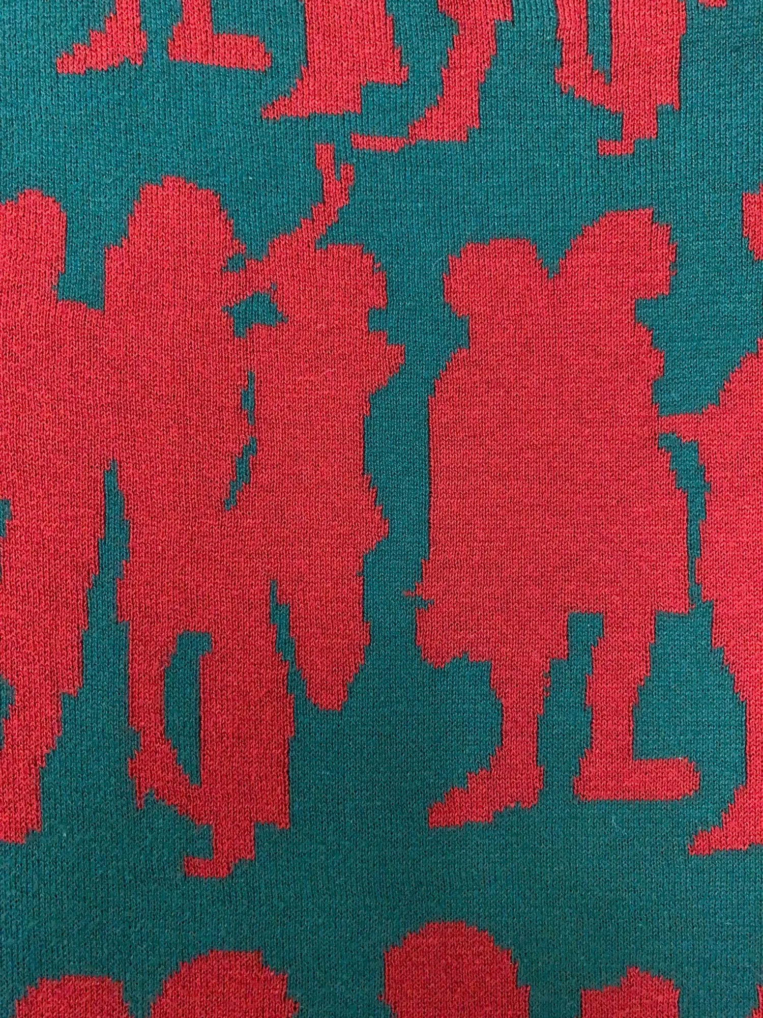 Jocomomola de Sybilla green knitted cotton vest with red dancing figures